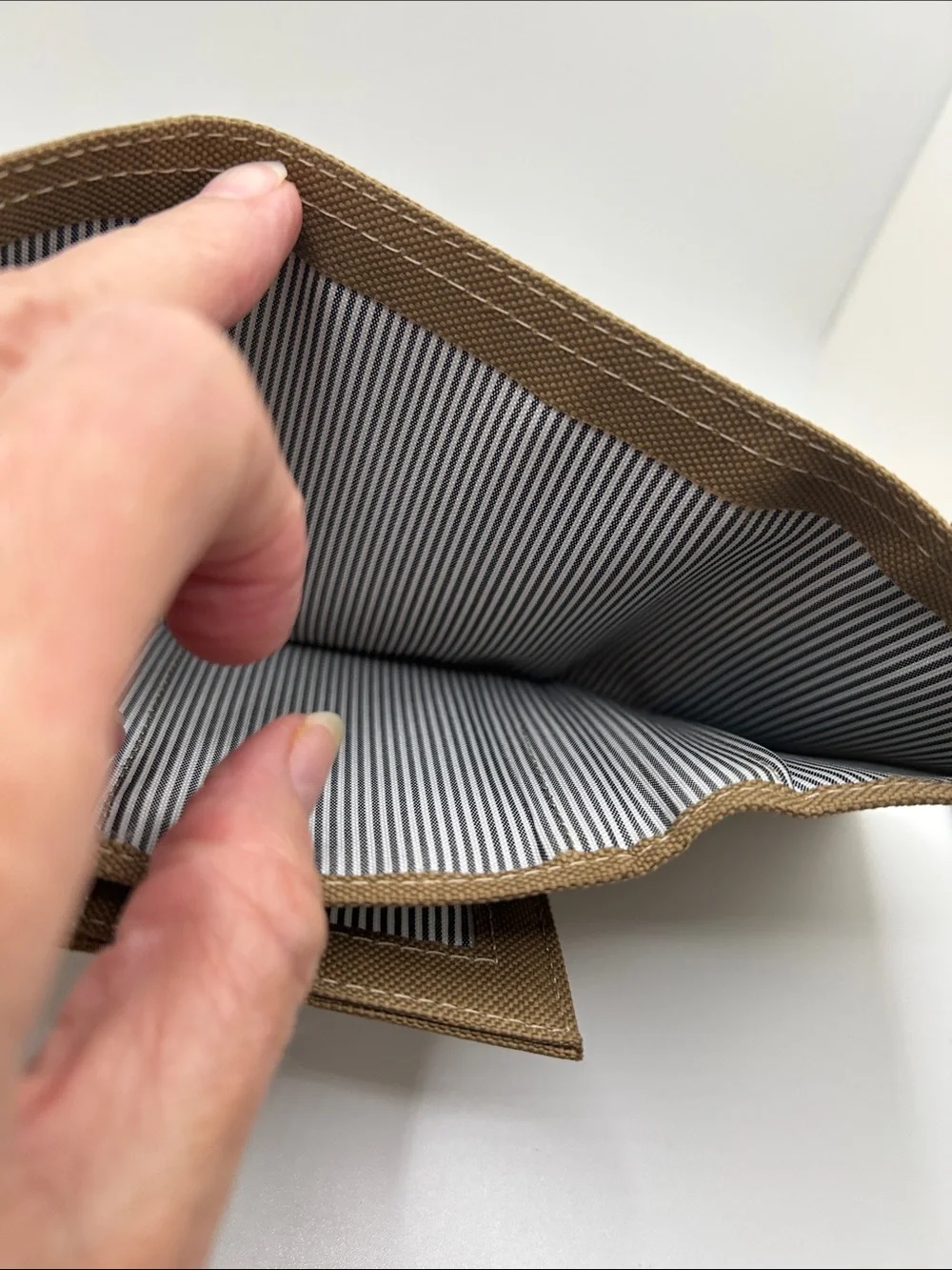 Canvas wallet. Open its 9.5. 4.5 H trifold